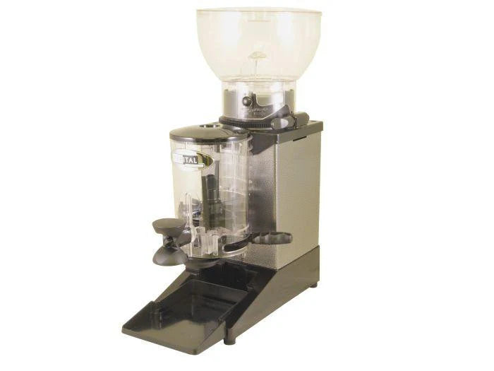 Cunill Tauro grinder in use dispensing ground coffee into portafilter with integrated tamper