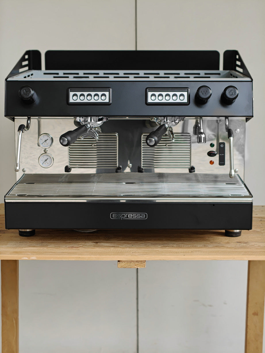 Espressa Atlantic 2-group professional espresso machine front view with stainless steel body and programmable control panel