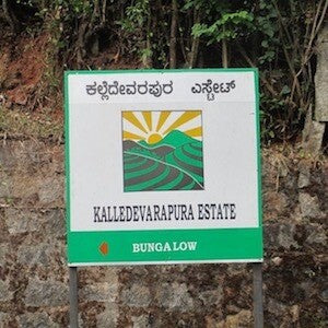 Lorien coffee estate signboard displaying estate name and location