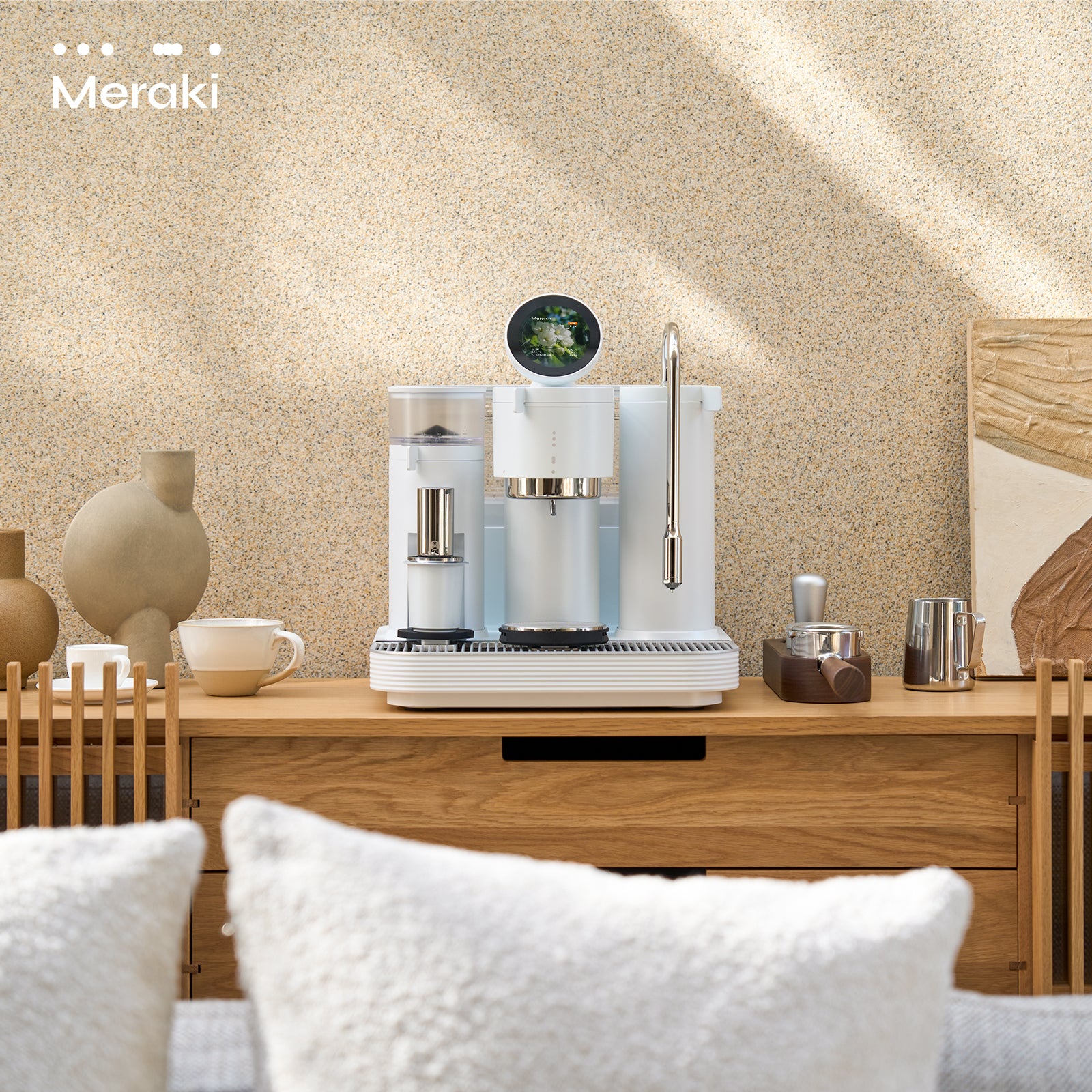 Meraki Espresso Machine white edition on table in cozy bedroom setting.