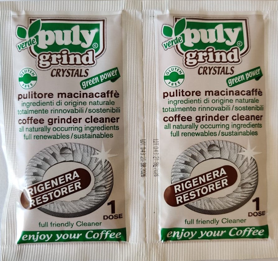 Two Puly Grind Verde Crystals sachets showing green eco-friendly packaging with grinder cleaning instructions and organic certification.