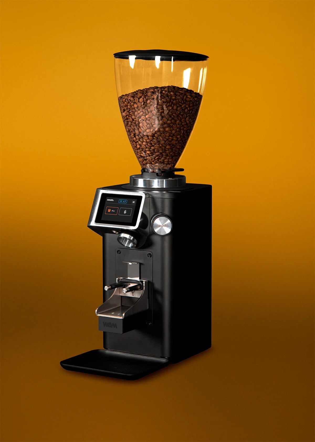 REV Titan WAM grinder posing on yellow background highlighting elegant modern design