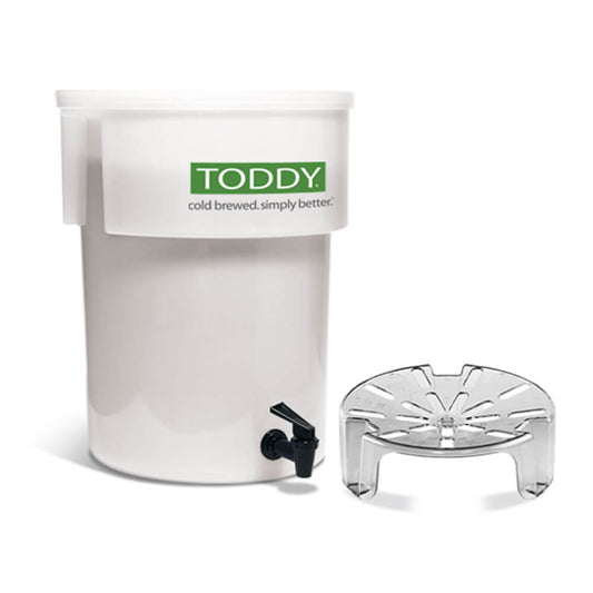 Toddy Cold Brew Commercial Model with Lift featuring white brewing container with green logo, black spigot, and perforated lift platform.