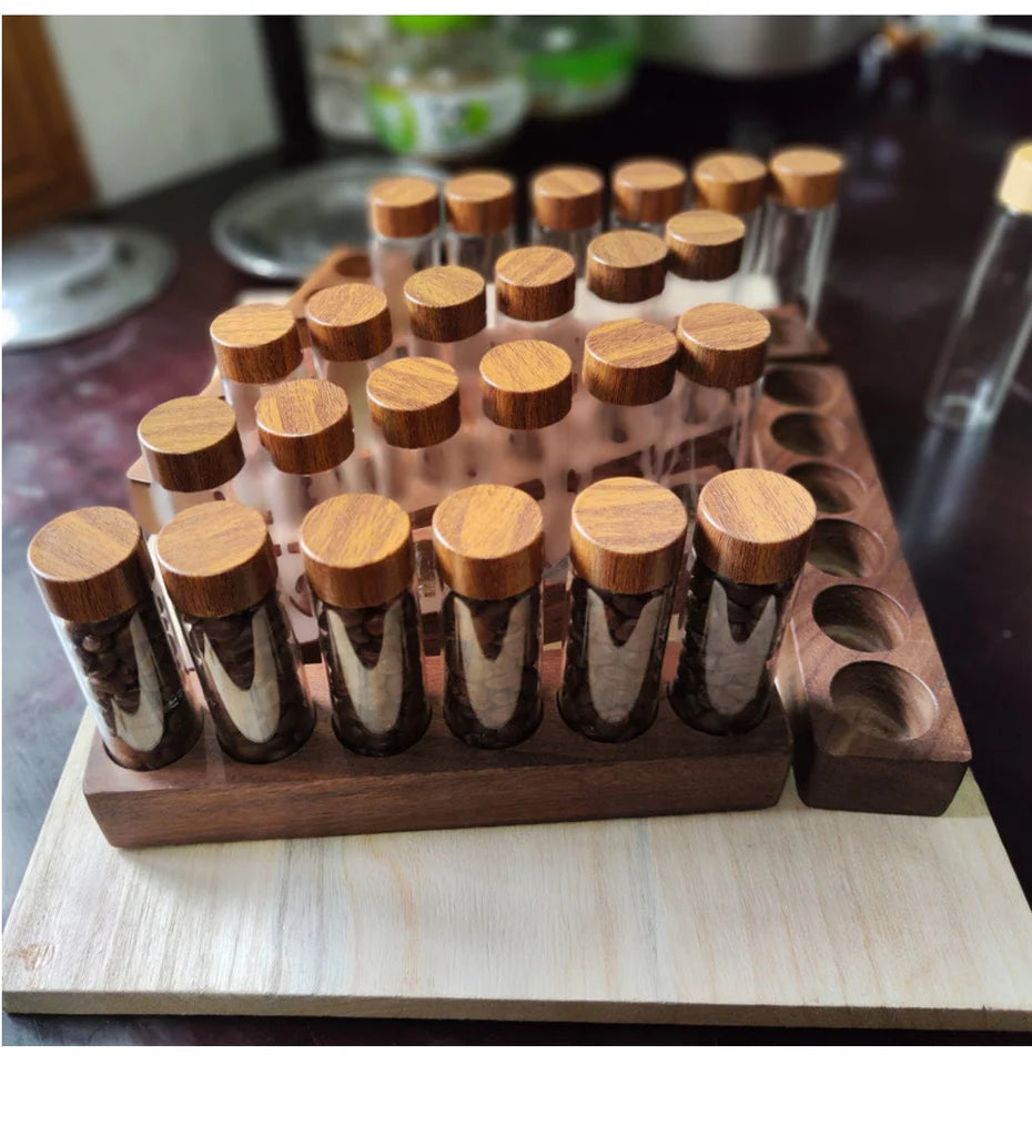 Set of small glass bottles with wooden lids on a wooden stand