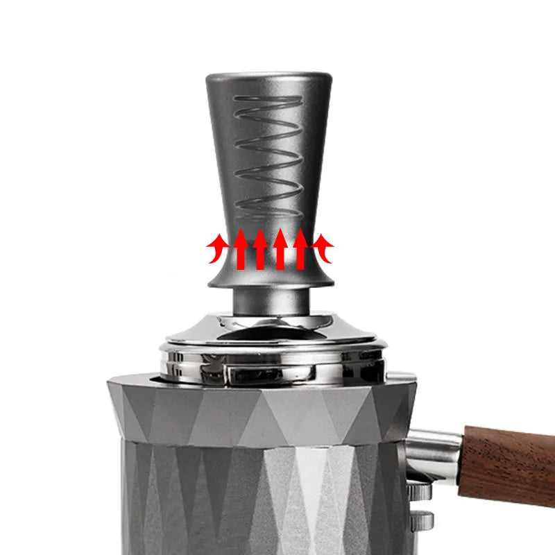 Coffee grinder with a focus on the metal component and wooden handle on a white background