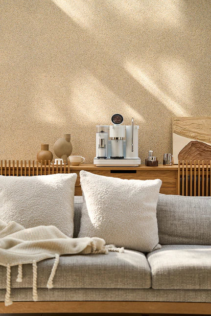 Cozy living room with a sofa, coffee table, and decorative items.