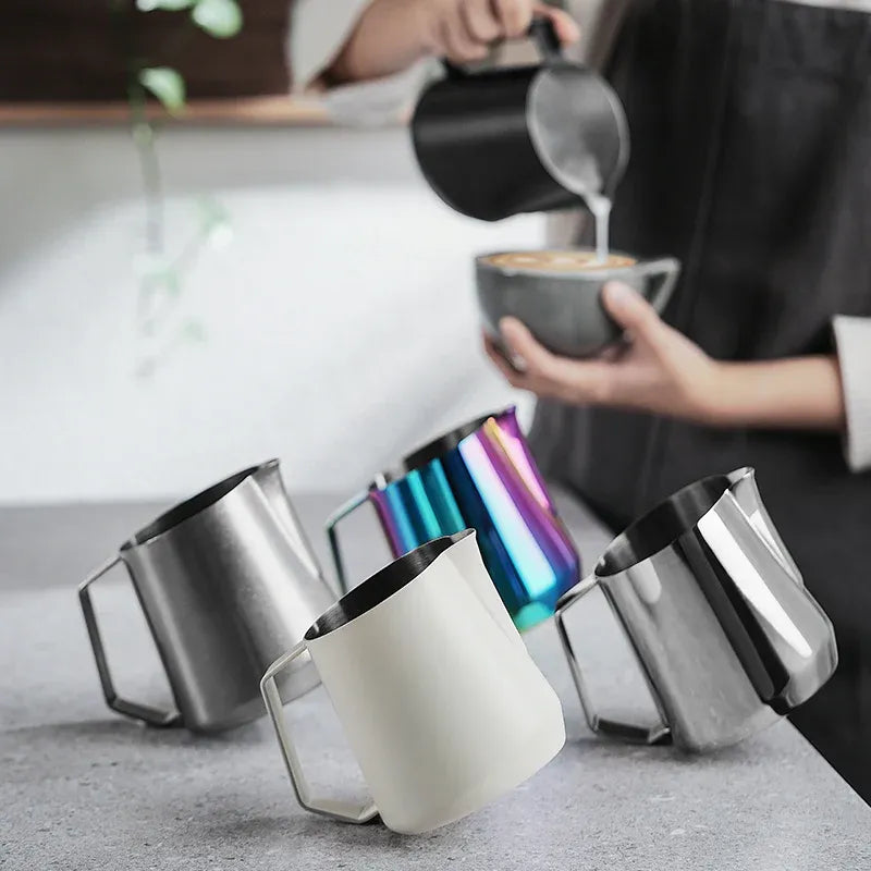Person pouring coffee into a mug with colorful insulated mugs on a surface.