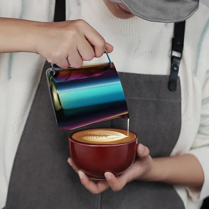 Person holding a colorful metallic container over a cup of coffee
