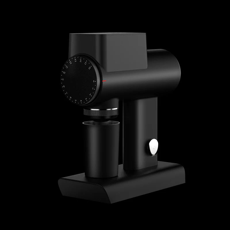 Black coffee grinder on a black background