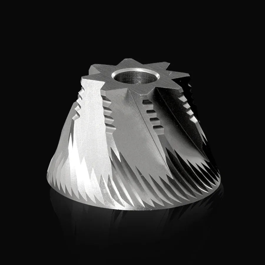 Metal gear or pulley component on a black background