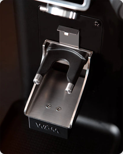 Ceado REV Steel grinder dosing ground coffee into portafilter with Weight Adjustment Module
