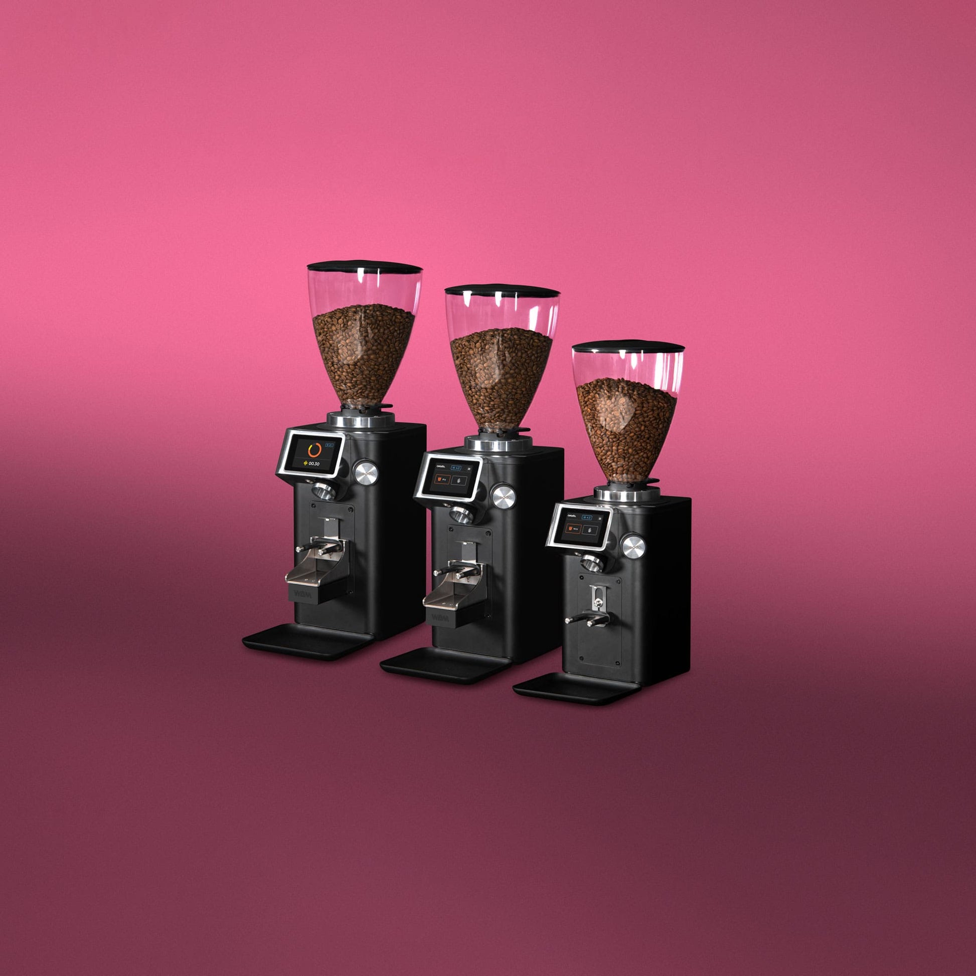Three Ceado REV Zero grinders arranged together with pink background showcasing different sizes