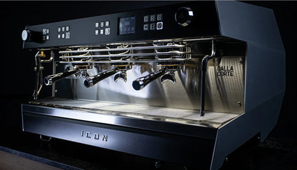 Side profile of Dalla Corte Icon 2-Group showing dual groups, steam wands and professional construction
