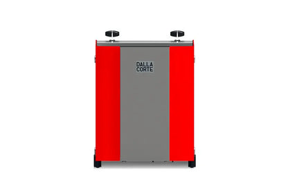 Red back view of Dalla Corte Studio espresso machine highlighting water connections and vents