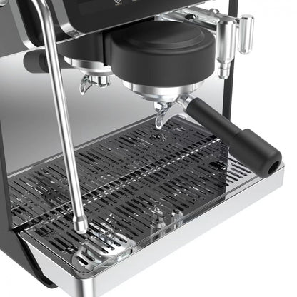 Close-up of Espressa Alpha H6 espresso machine grouphead, drip tray, and portafilter.
