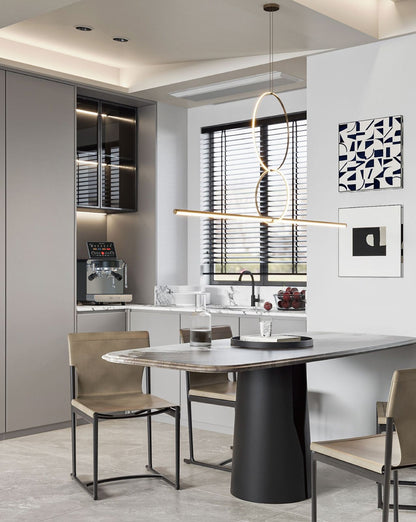 Espressa Alpha H6 espresso machine set up in modern coffee bar setting with table and chairs.
