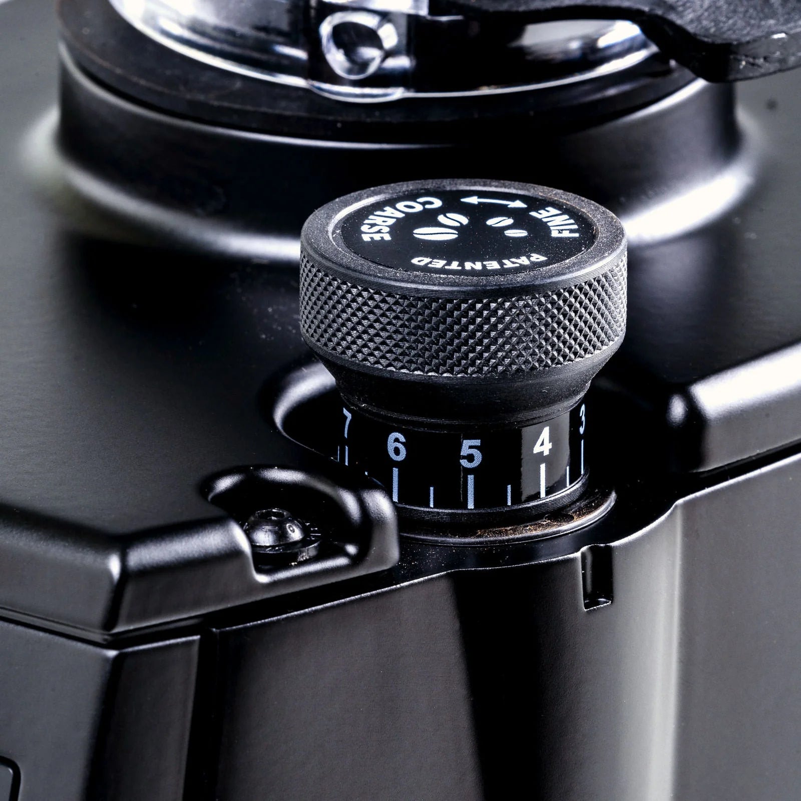 Close-up detail of Eureka Atom W75 75mm flat steel burr assembly showing precision engineering
