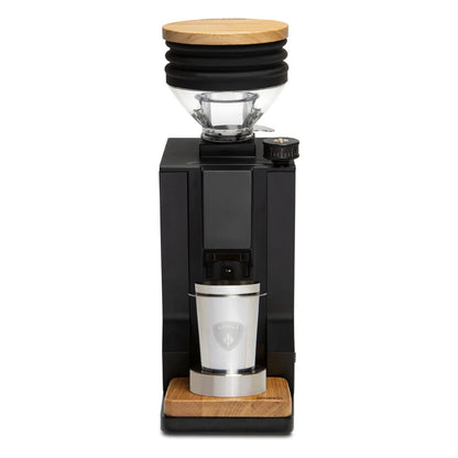 Side angle of Eureka Mignon Single Dose grinder with wooden hopper and metal dosing cup.
