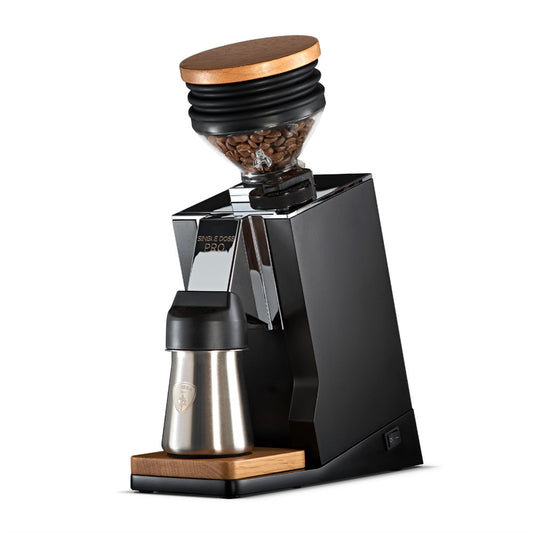 Eureka Mignon Single Dose PRO coffee grinder, black finish, wooden accents, steel dosing cup.
