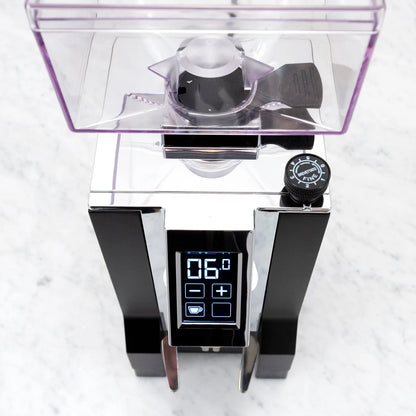 Close-up of Eureka Mignon Specialita touchscreen display with programmable dose settings.
