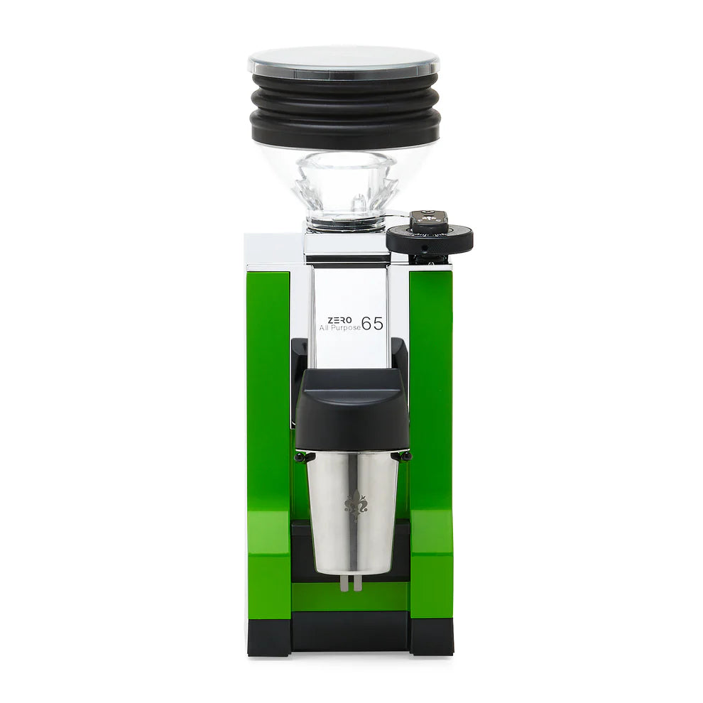 Eureka Mignon Zero 65 in green finish on kitchen counter with brewing accessories.
