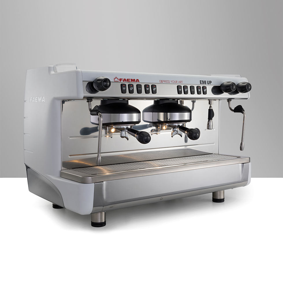 Side view of Faema E98 UP A/2 showing dual steam wands and ergonomic design.
