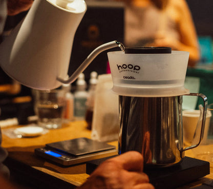 Hoop Coffee Brewer being used by barista in a specialty cafe setting
