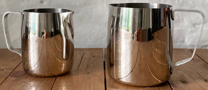Set of small stainless steel milk pitchers for latte art and frothing
