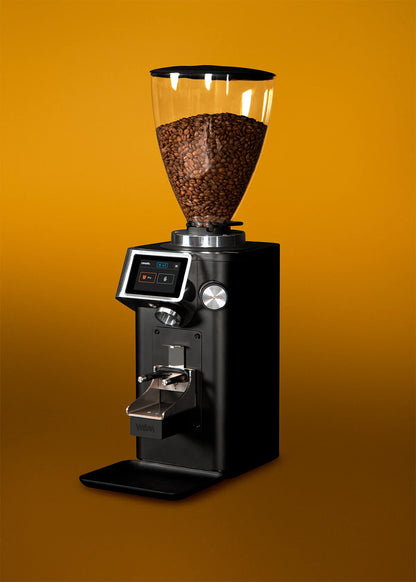 REV Titan WAM grinder posing on yellow background highlighting elegant modern design

