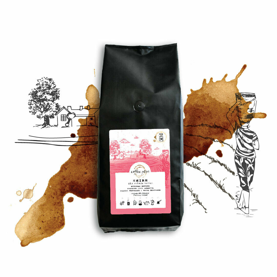 Shire coffee bag with artistic pink label featuring botanical illustrations and bright origin branding
